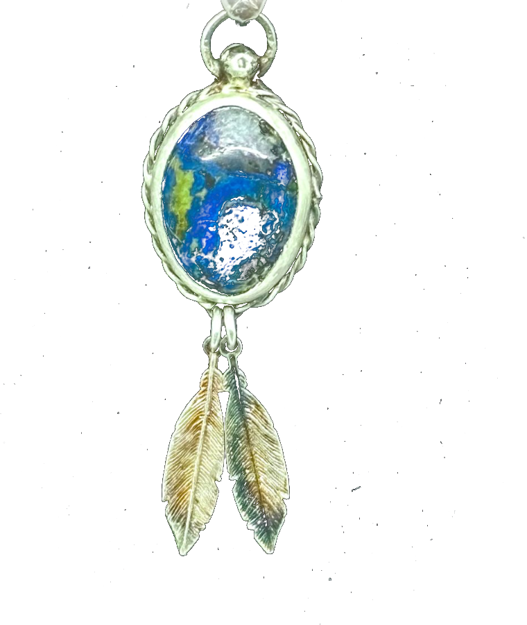 Silver pendant with an azurite stone and chased feather details, made in Noah Santella's studio